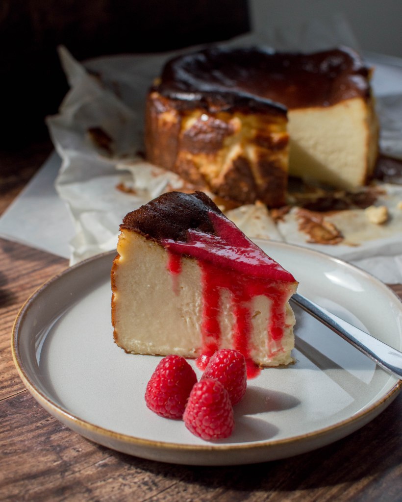 Burnt Basque Cheesecake Served With Raspberry Coulis - Kay's Kitchen